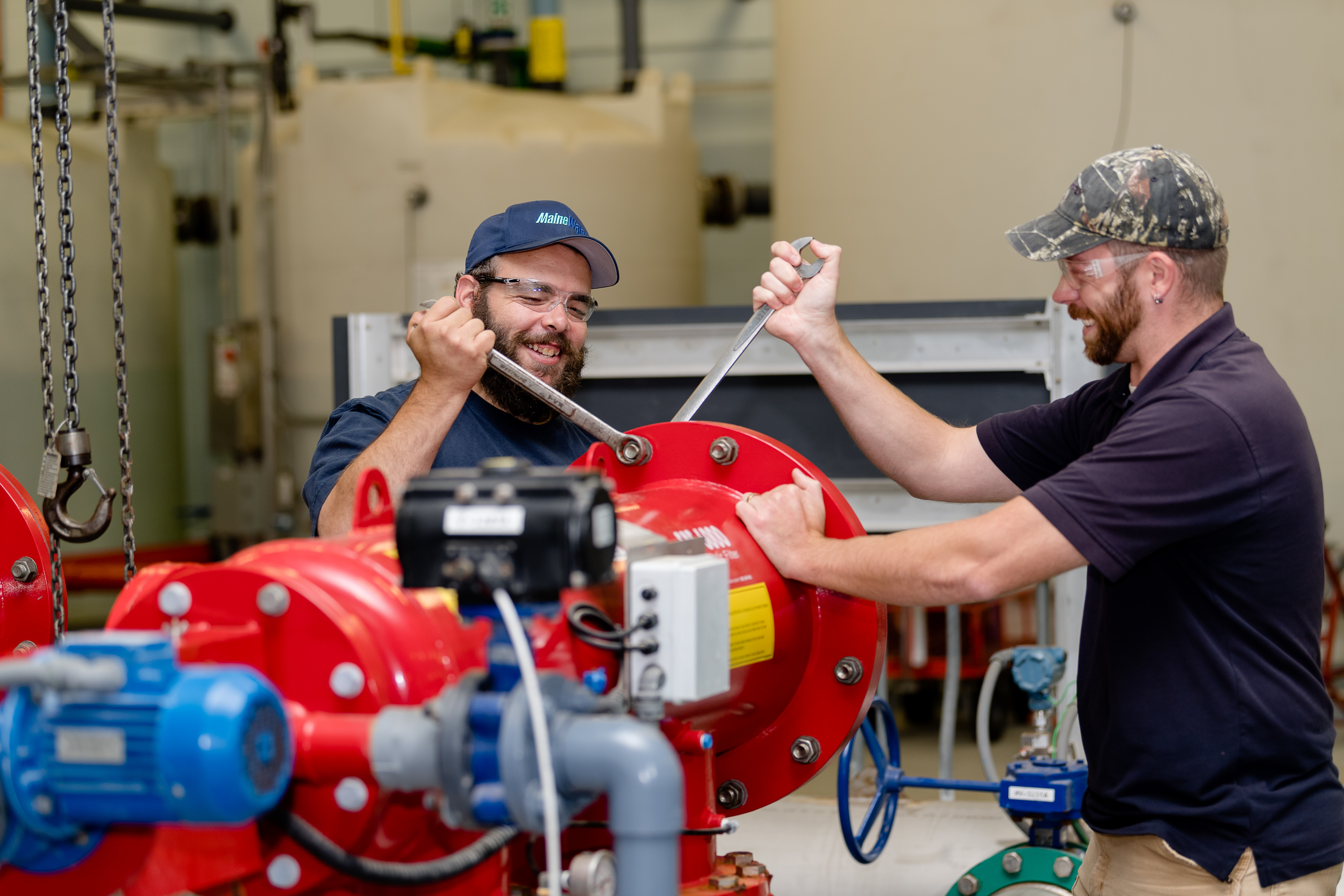 Maine Water employees working on pipes