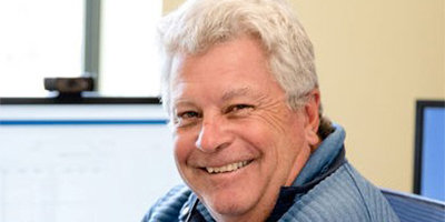 headshot of Greg Leighton