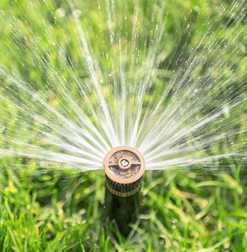 a water irrigation sprinkler spraying water
